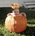 Samantha in a pumpkin